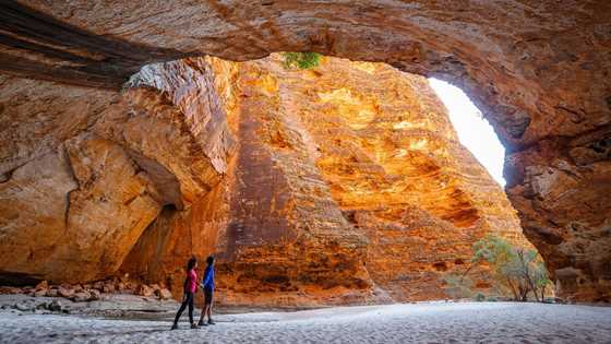 A couple exploring the Kimberley red rock gorges