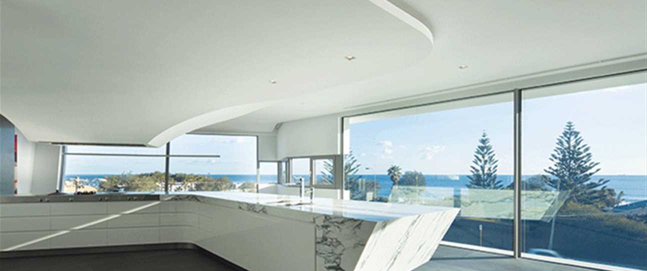 This beach house in Trigg, by Hillam Architects, boasts an open aspect and cool material palette that make the interior feel light and airy.