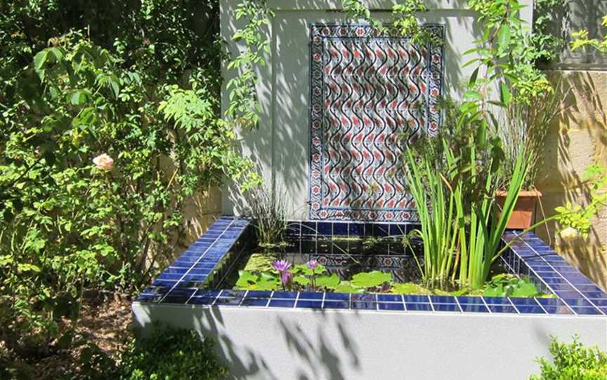 Waterlily pond/water wall with tiles bought  in Turkey by the owner