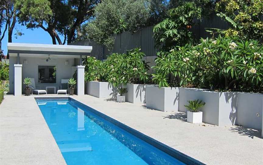 Lap pool with cabana, edged with frangipanis