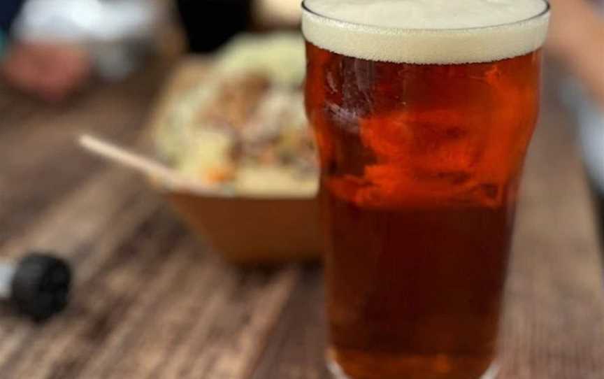 A pint of craft beer with food.