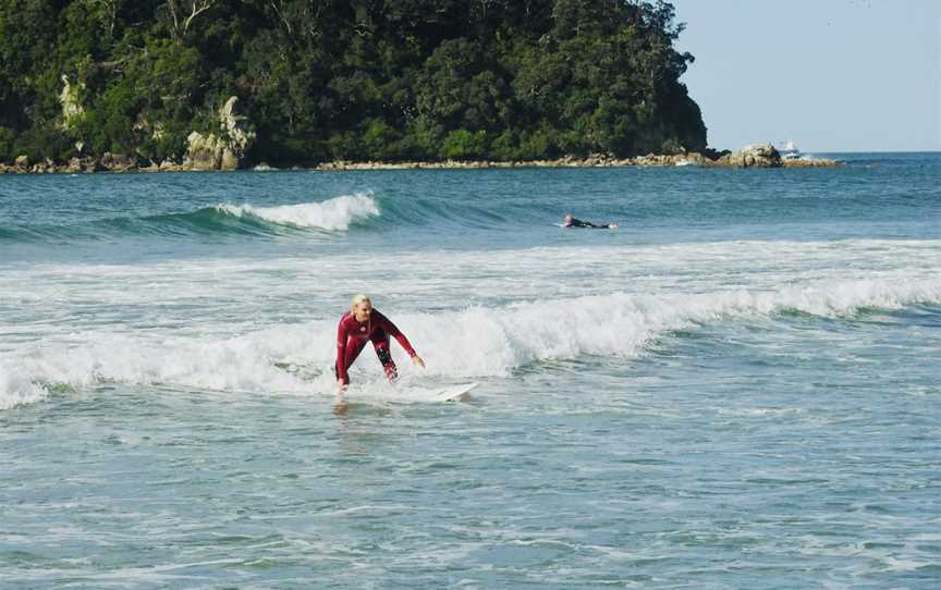 Learning to surf in a surf lesson in Mount Maunganui.