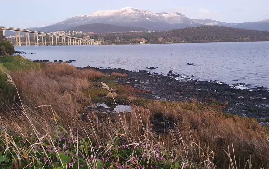Winter views of a snow covered kunanyi / Mount Wellington, taken at the end of Yolla Street and the start of the Esplanade along the Rose Bay foreshore trail.