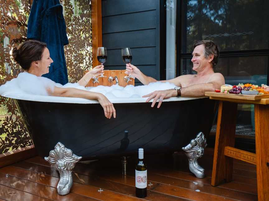 Outdoor baths on the back decks of each chalet