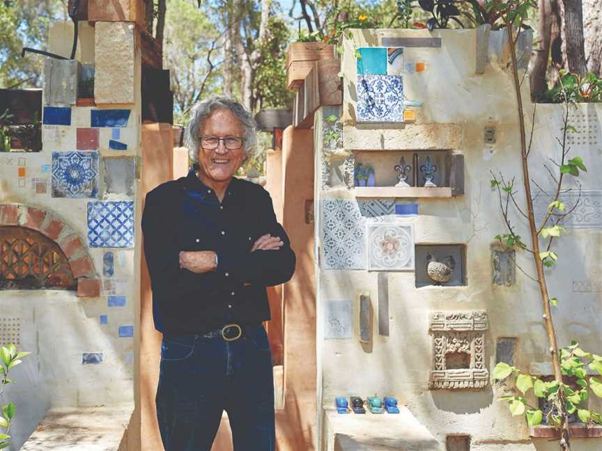 Leon Pericles stands in front of his Margaret River garden installation 'Moss Garden Ruins'
