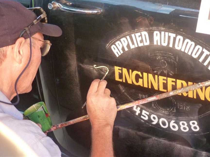 Painted logo with scrolls for restored Chevy ute.