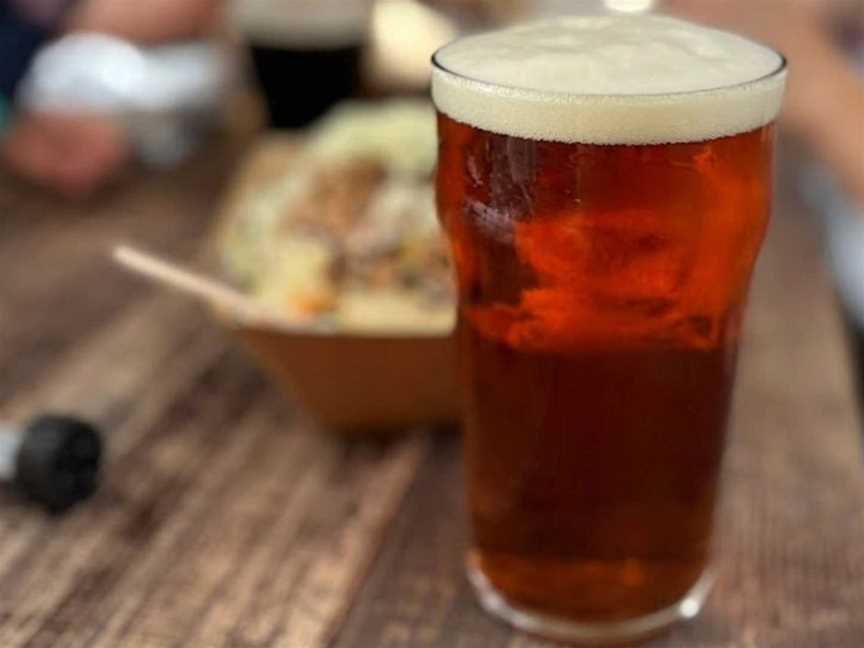 A pint of craft beer with food.