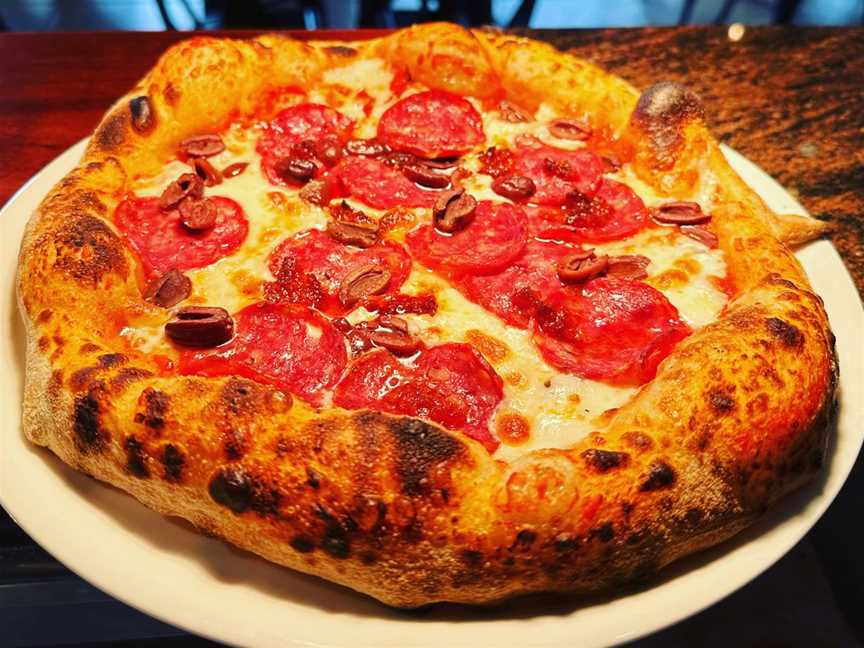 Delicious wood-fired pepperoni pizza, freshly baked to perfection at La Bella Italia | Pizza Restaurant.