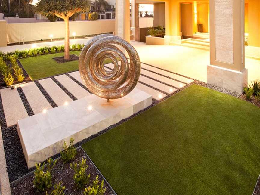 This waterwise garden in Applecross with dramatic mature Dracaena Draco transplant, provides balance against an artistic sculpture