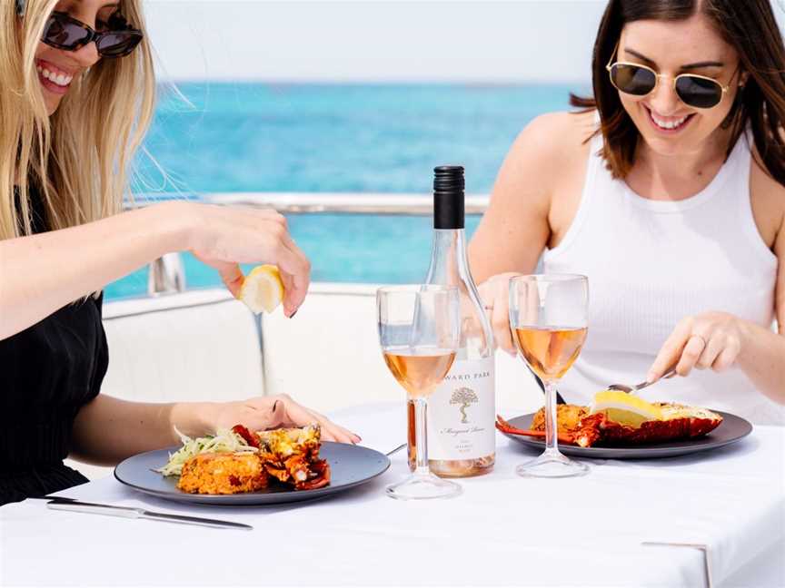 Dining on the water with fresh local seafood and produce showing the Margaret River region.