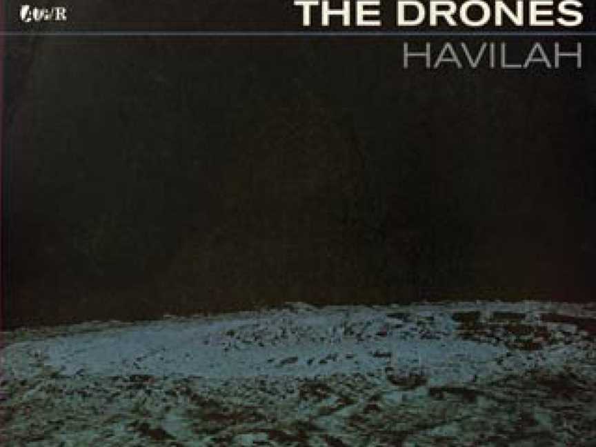 The bottom third is a black-and-white shot of a lunar landscape, a small crater is in the foreground. A larger crater is near the horizon. The rest of the cover is black except for the lettering near the top. At left is the record label's logo of fou