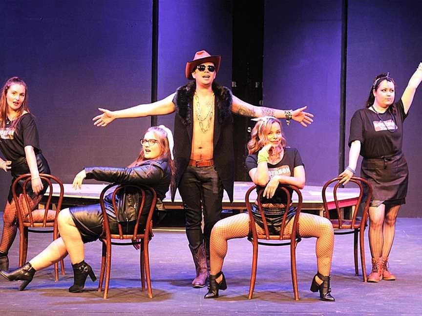 Wilton Kerr, centre, as Stacee Jaxx with his groupies (Ellie Coburn, left, Genevieve Chalkley, Laura Kovler, Elizabeth Del Casale) in Rock of Ages. Picture: Ashleigh Taylor