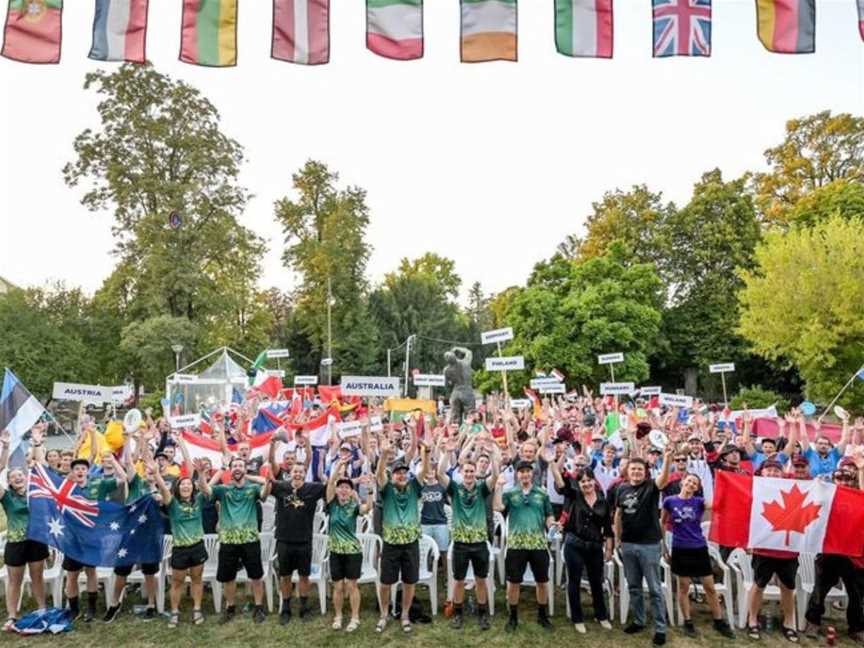 International teams celebrating disc golf