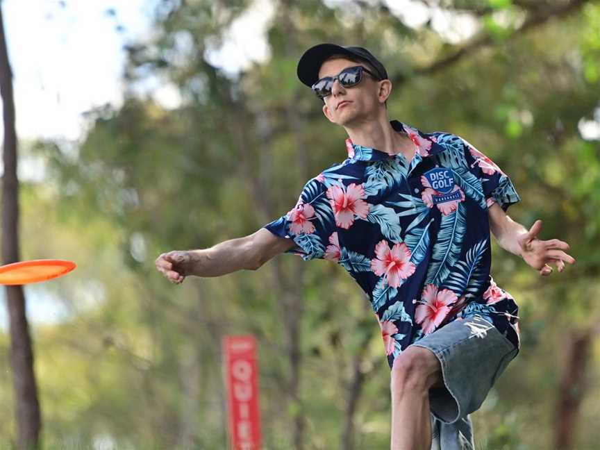 Man letting fly a disc.