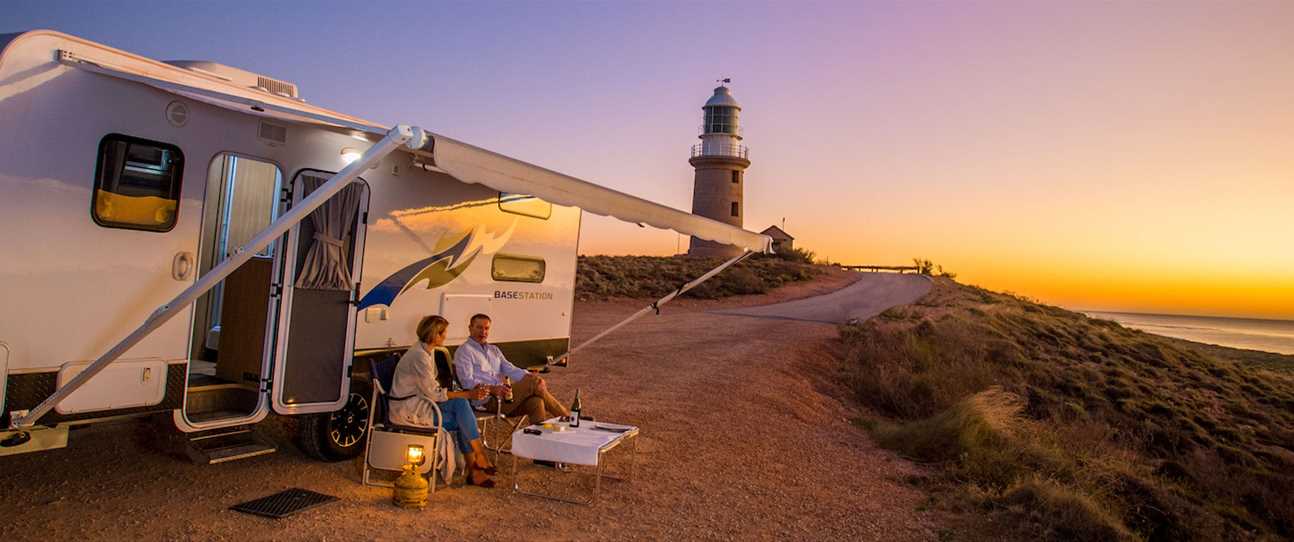 Couple with Caravan at sunset at Vlamingh Head Lighthouse